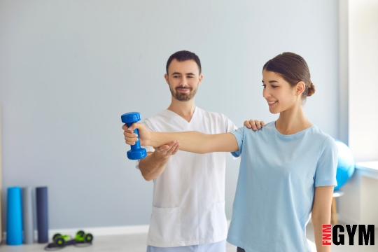 male and female working out with weight in clinic setting